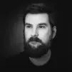 grayscale photography of man wearing crew-neck shirt